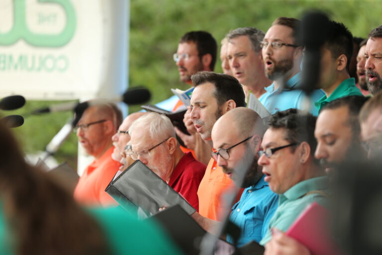 The Columbus Gay Men’s Chorus warms up “Pride at the Fest!” on the ABC6 Bicentennial Park Stage with one of their season’s musical selections. Credit: Joe Maiorana.