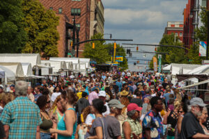 Crowds of art lovers swarm a stretch of Arts Festival tents on Main Street. Credit: David Heasley.