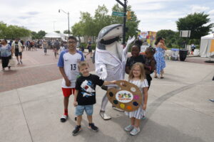 Festival mascot Art Shark with kids