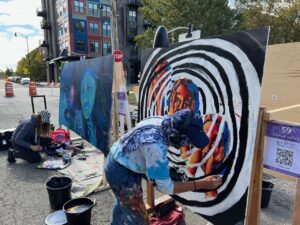 Artists live painting murals at Scrawl 2022