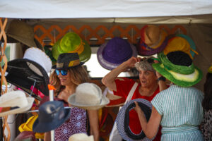 Guests shop for hats